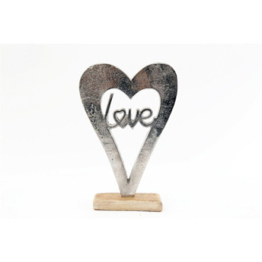 Coeur d'amour en métal argenté sur un socle en bois grand